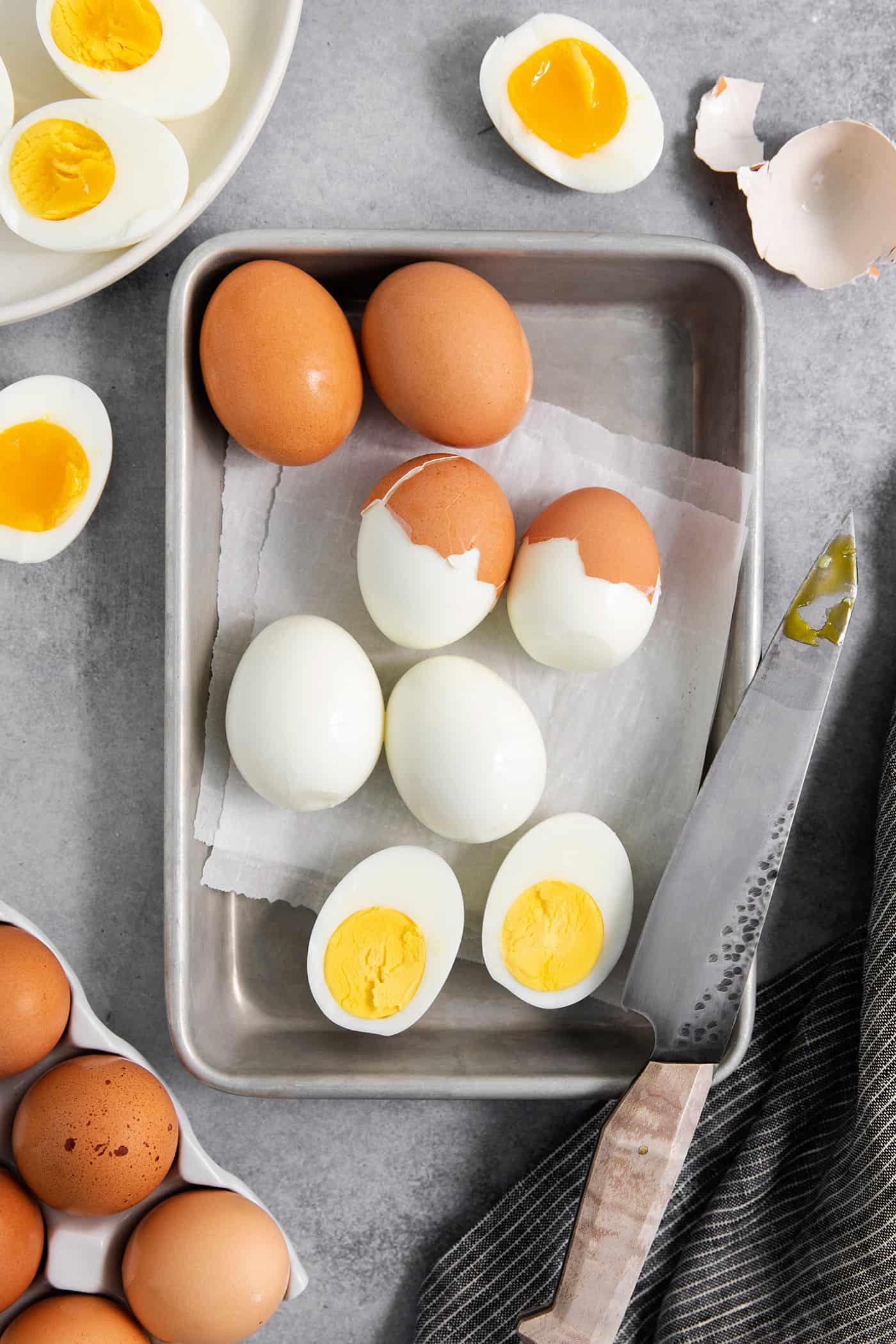 overhead photo of hard boiled eggs that show the shell coming off perfectly