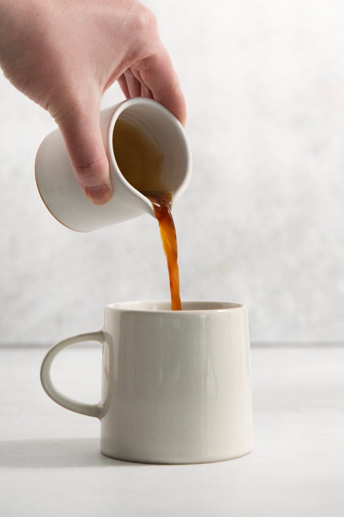 Espresso is poured into the mug.