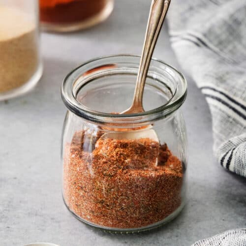 close-up photo of a jar of homemade blackened seasoning
