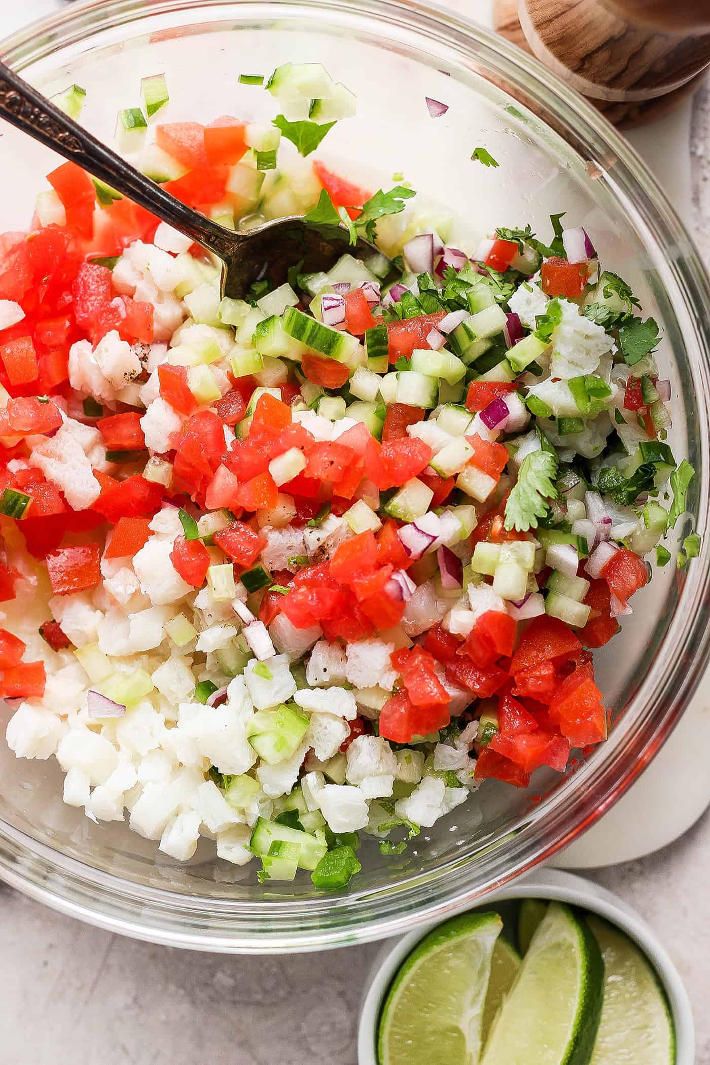 The classic ceviche ingredients are mixed together in a bowl.