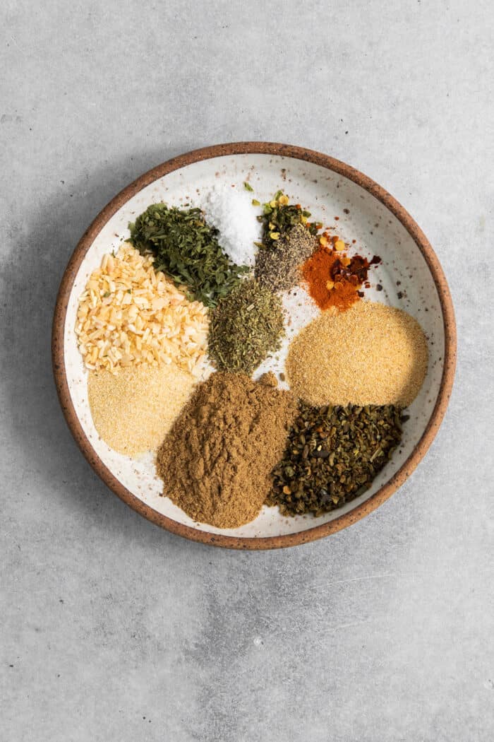 The spices and seasonings are added to a bowl.