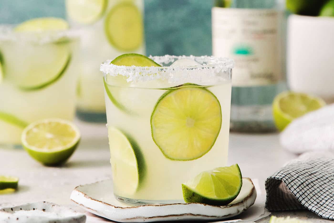 Lime slices float in glasses of classic margaritas.