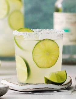 Lime slices float in glasses of classic margaritas.