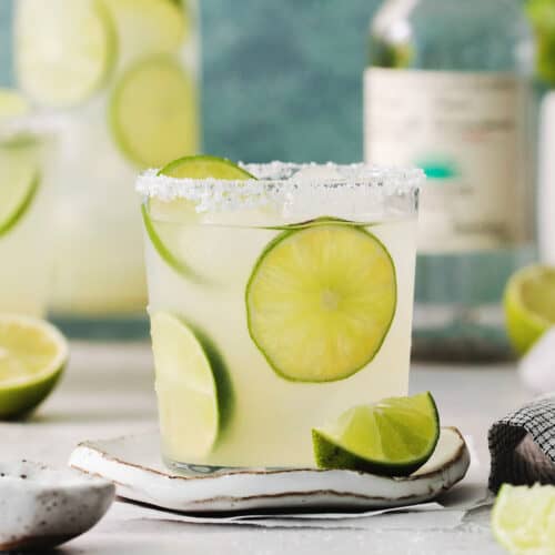 Lime slices float in glasses of classic margaritas.