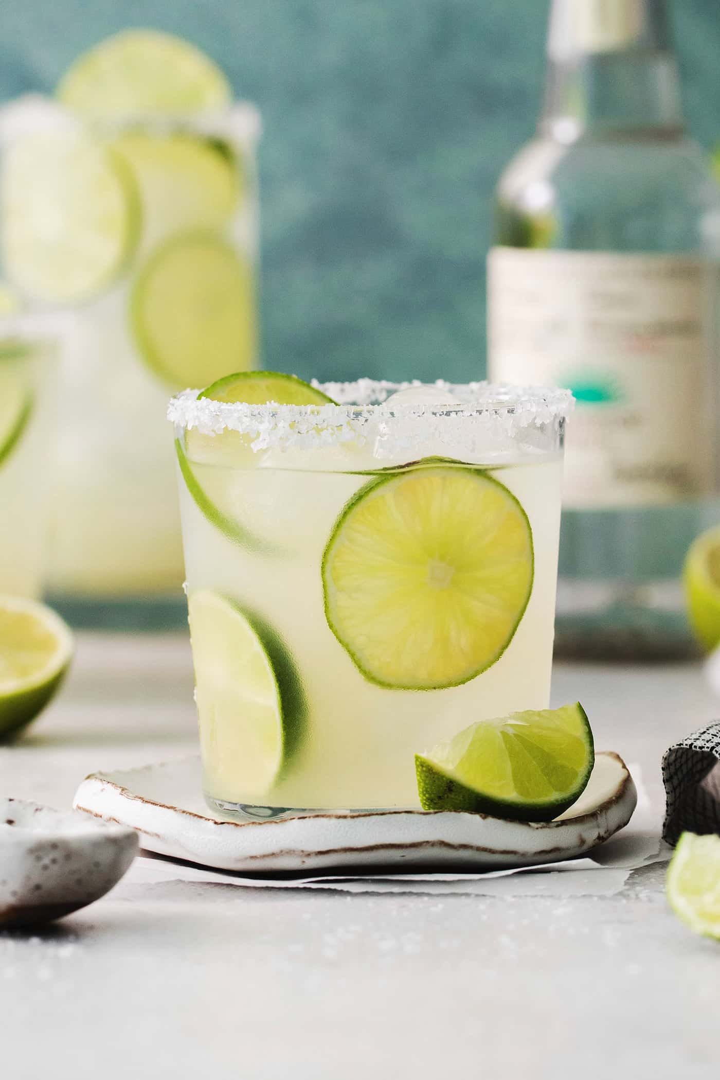 Lime slices float in glasses of classic margaritas.