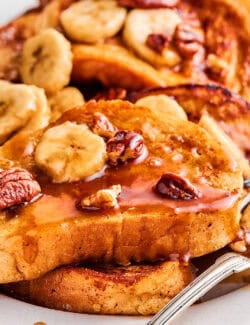 up-close photo of French toast with bananas foster sauce