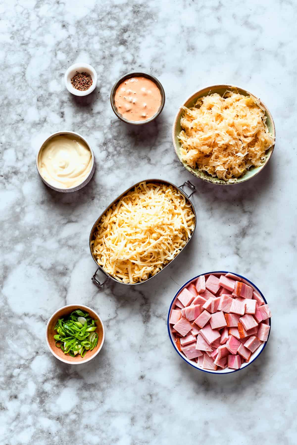 Overhead view of ingredients for hot Reuben dip