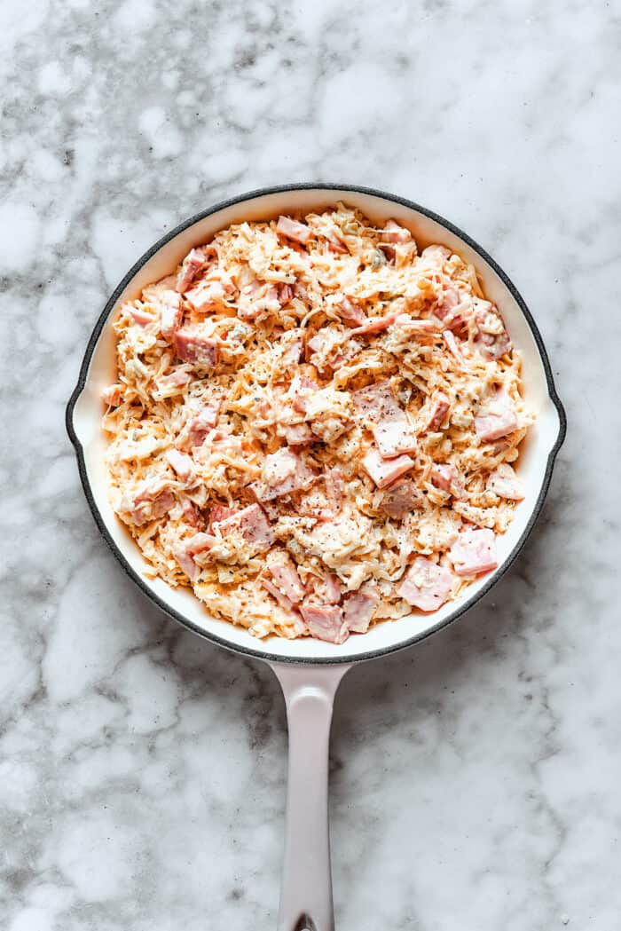 Overhead view of Reuben dip in pan before baking