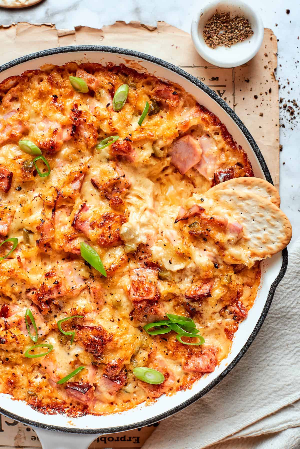 This easy hot Reuben Dip recipe is gorgeously creamy and tangy, and loaded with savory corned beef. All the flavors of the sandwich! Overhead view of Reuben dip in pan