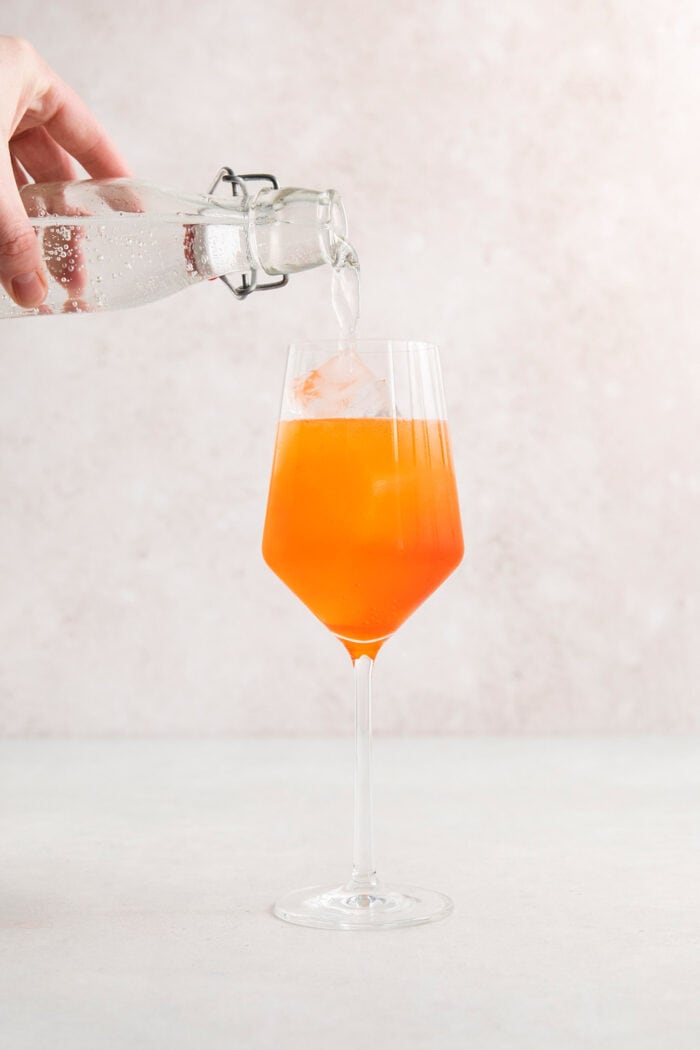 The Aperol spritz is topped with club soda.