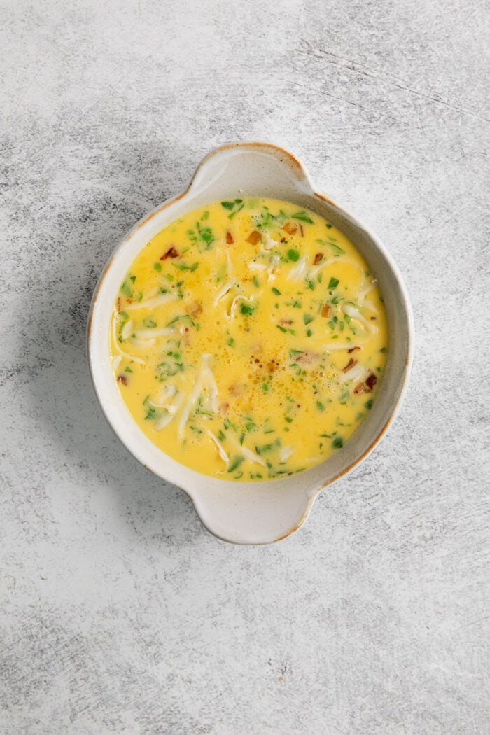 The egg mixture in a ramekin.