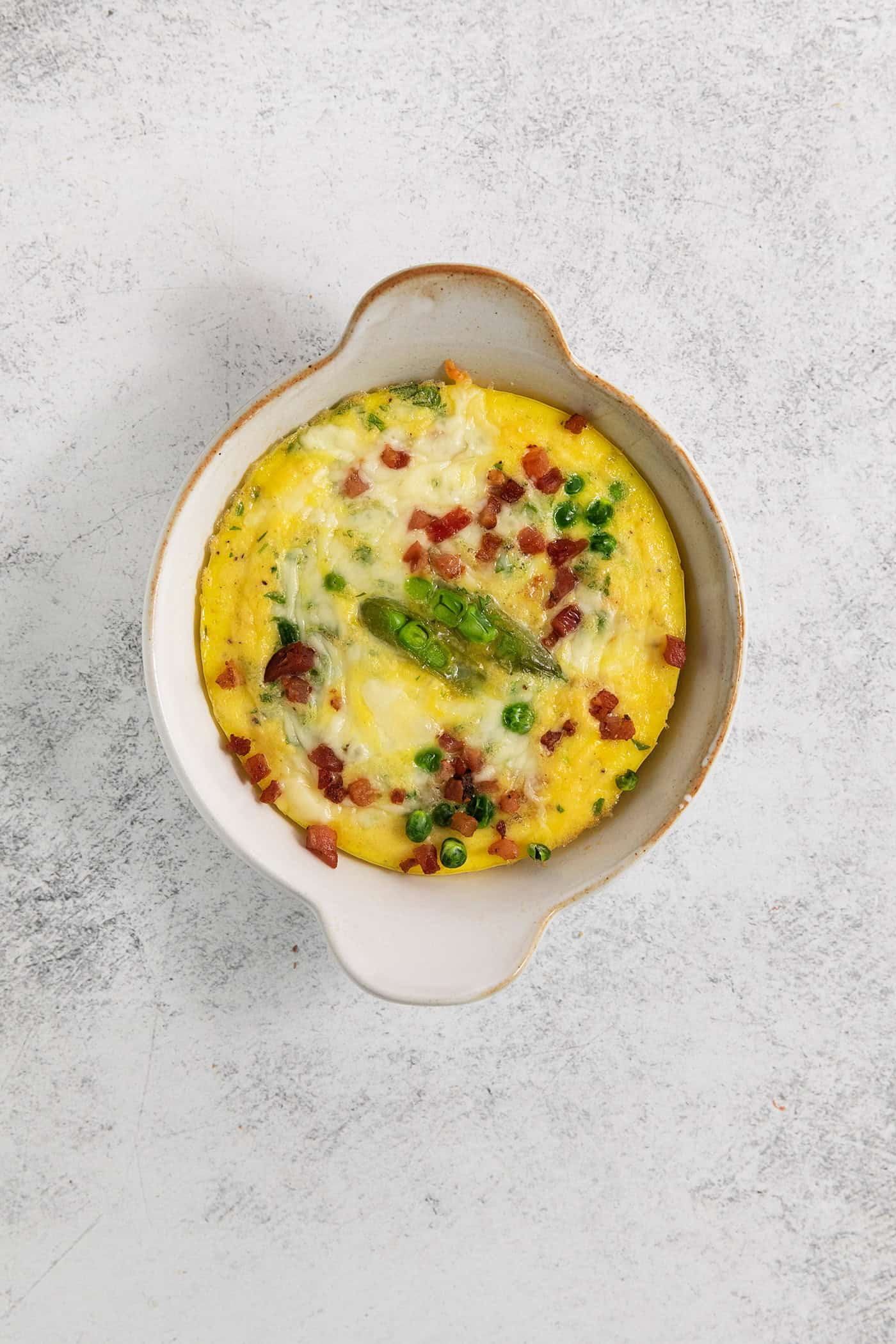 The baked eggss are shown after they come out of the oven.