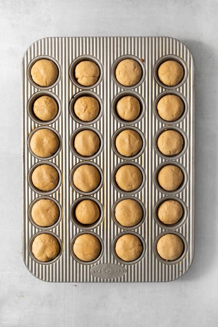 The peanut butter cup cookies in the tin after being baked.