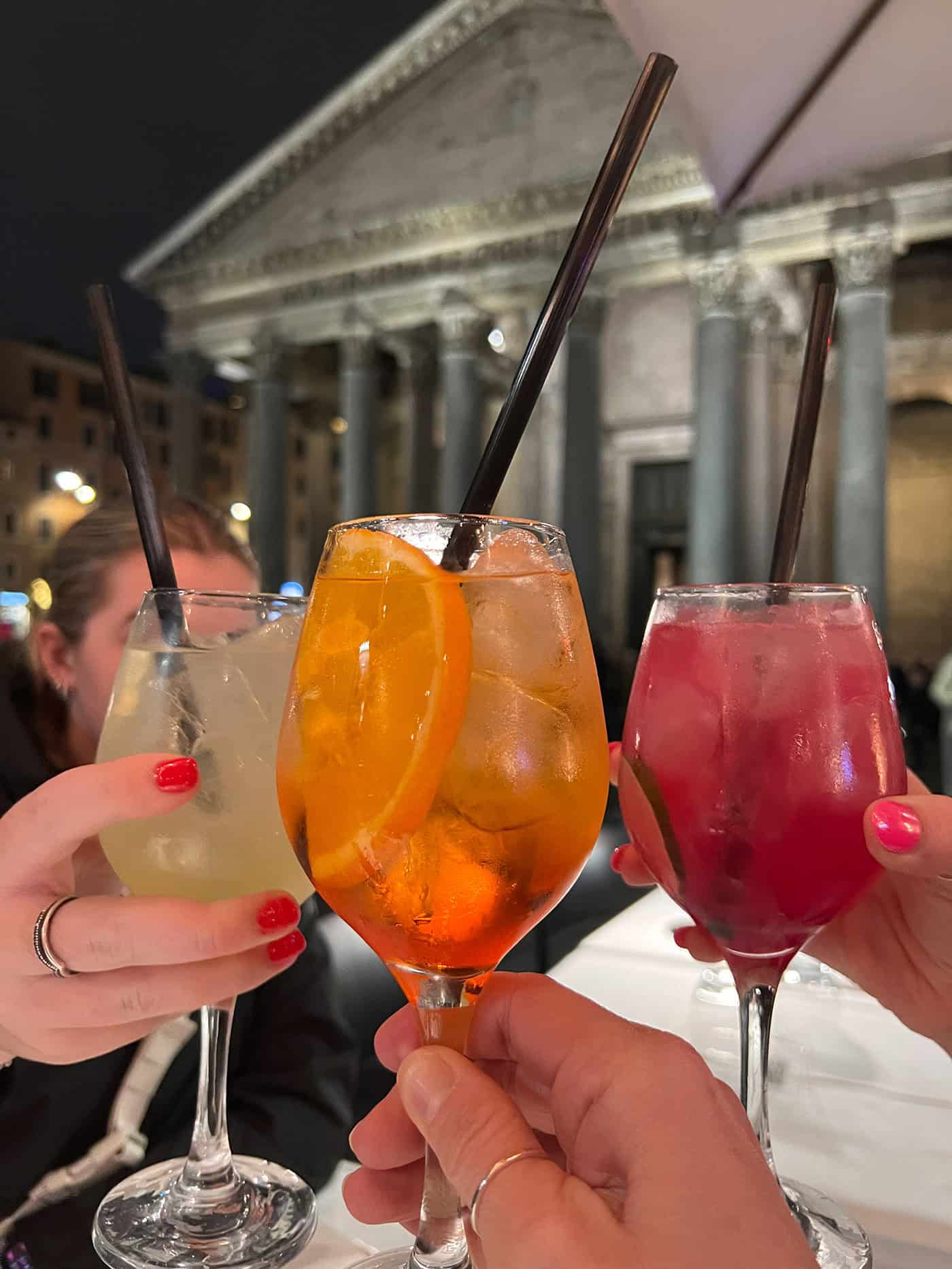 3 glasses of spritz drinks, outside the Pantheon in Rome