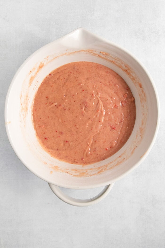The brownie batter is shown mixed in a white bowl.