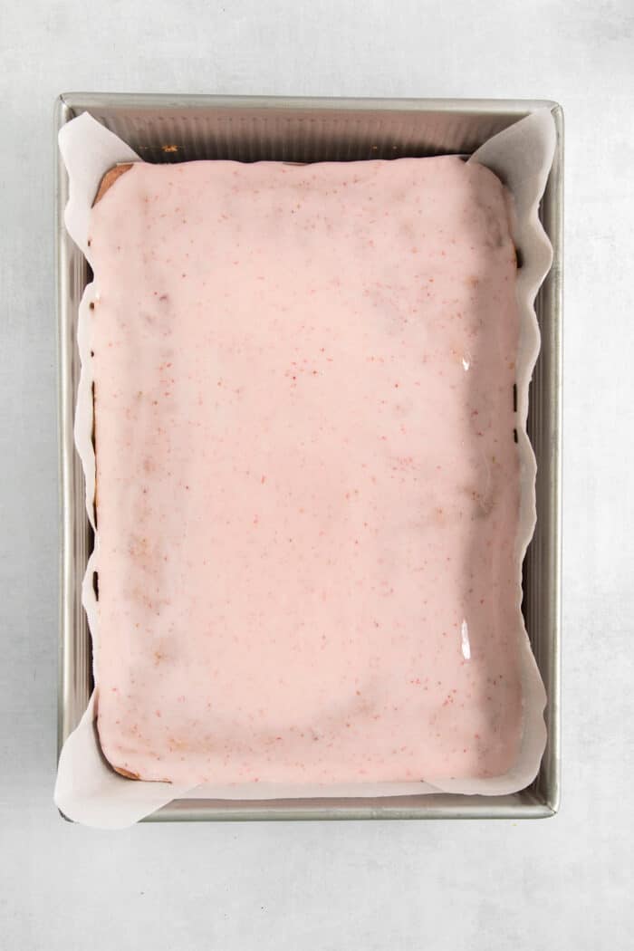 The icing layer is added to the brownies