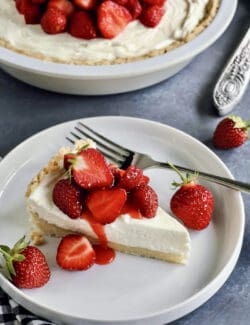 a piece of strawberry cream cheese pie on a white plate