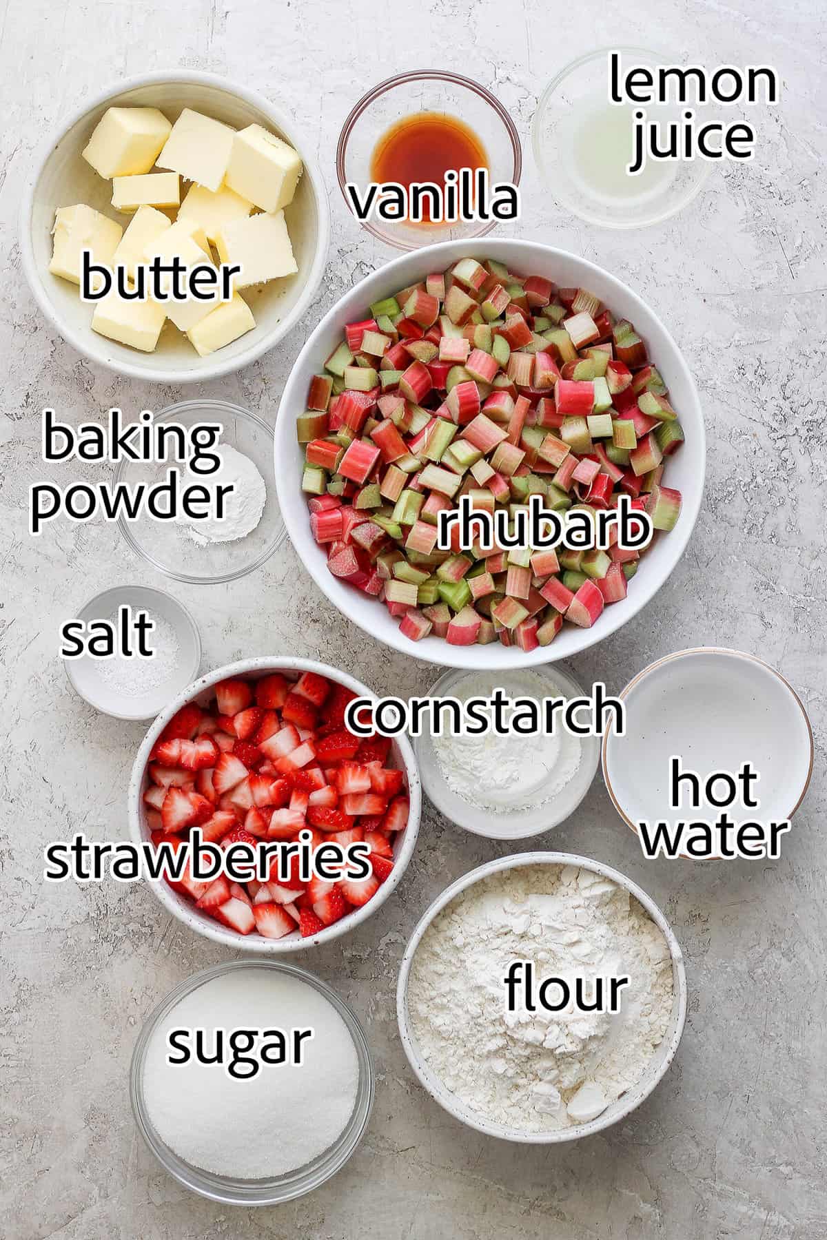 ingredients in bowls, to make strawberry rhubarb cobbler