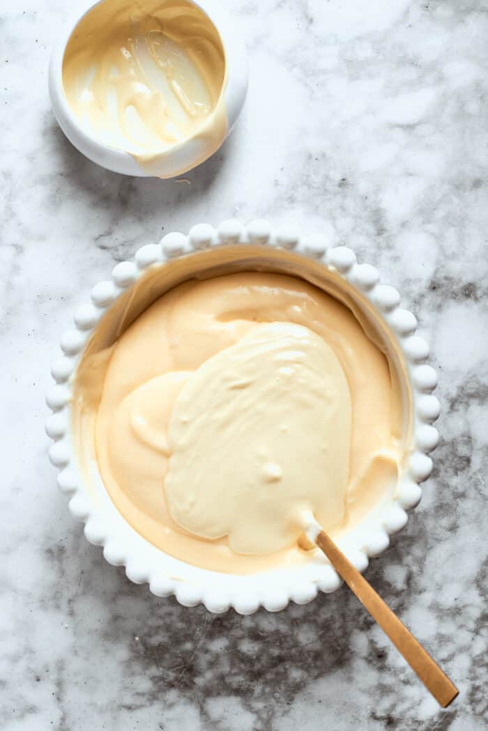Melted white chocolate is stirred into the cheesecake base.
