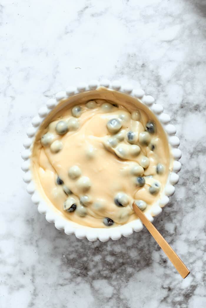 Blueberry cheesecake filling in a bowl.
