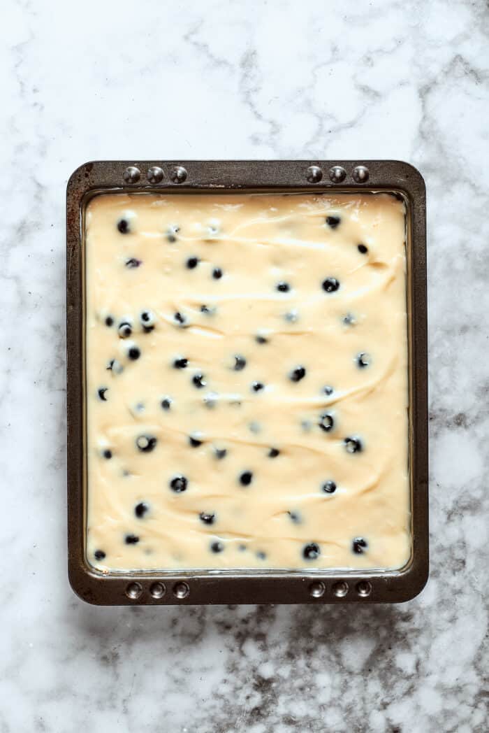 The cheesecake filling is added to the crust.