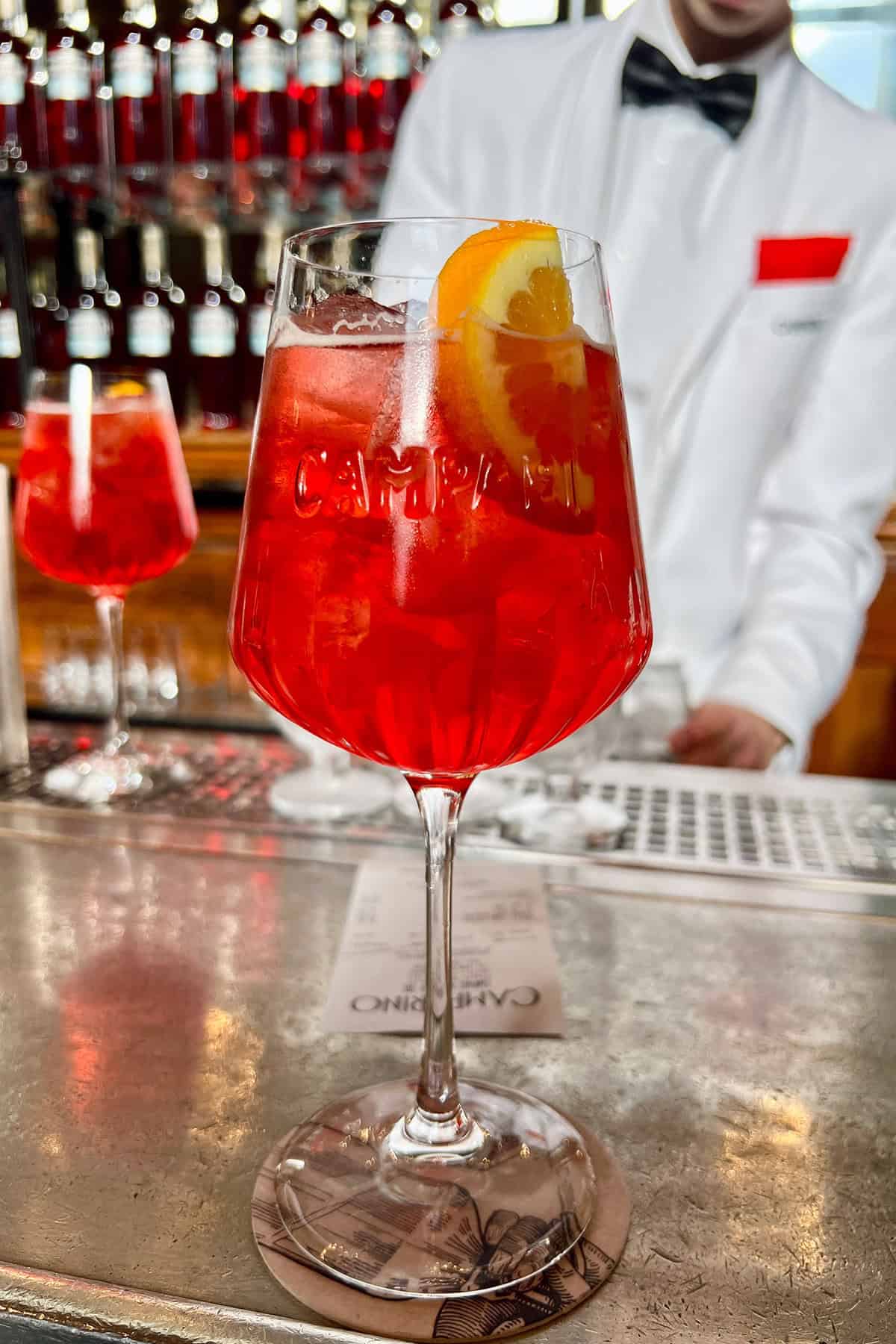 a glass of Campari Spritz cocktail at Camparino in Milan