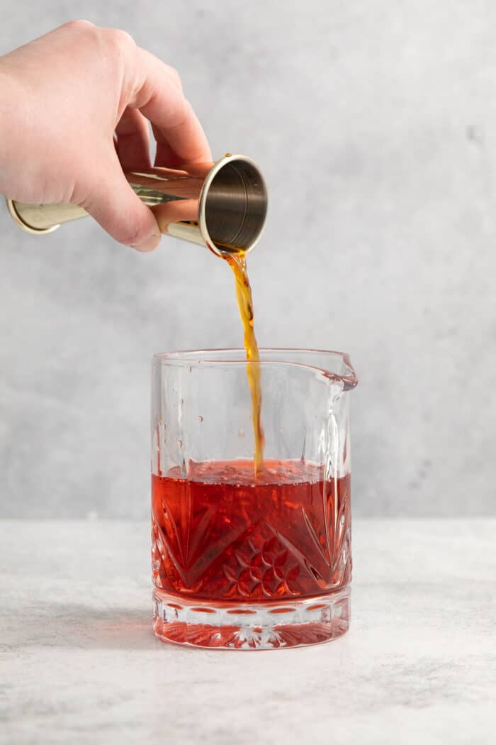 This classic Italian Negroni recipe features an easy 1-1-1 ratio of gin, Campari, and sweet vermouth and is served over ice. Sweet vermouth is added to a glass.
