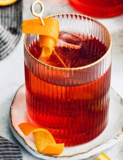 A twist of orange garnishes a Negroni.