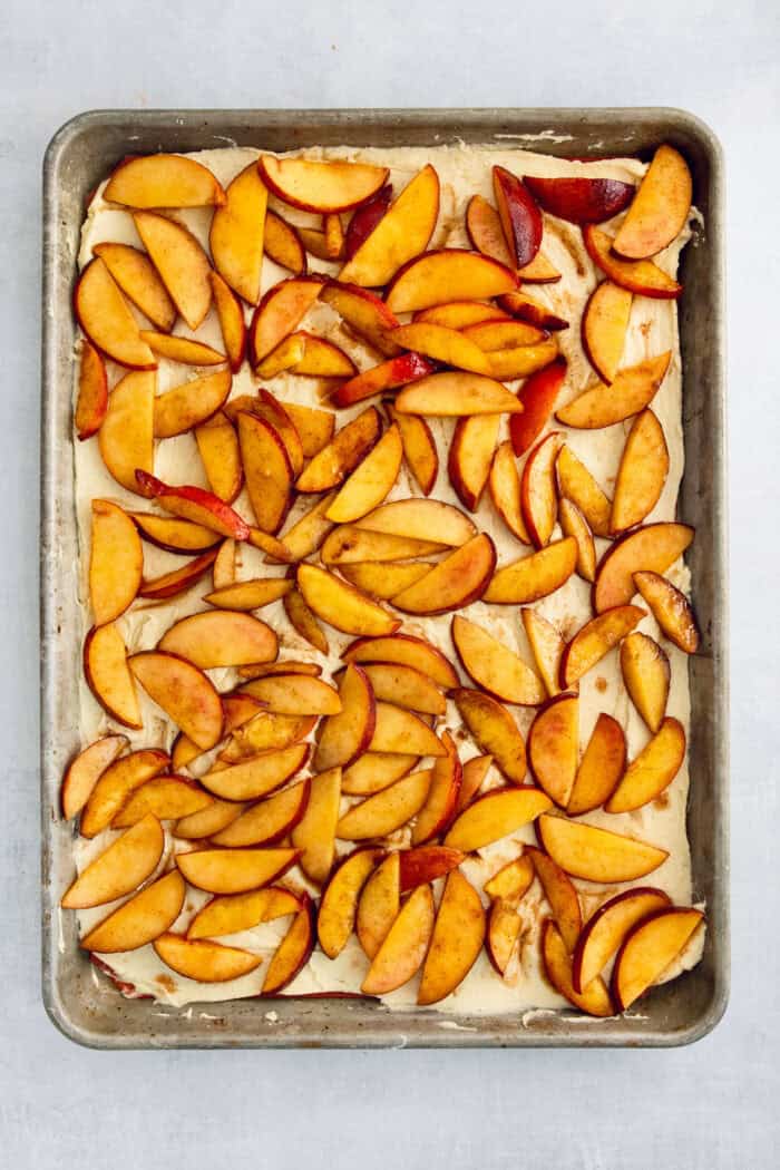 The peach filling is added to the bottom layer.