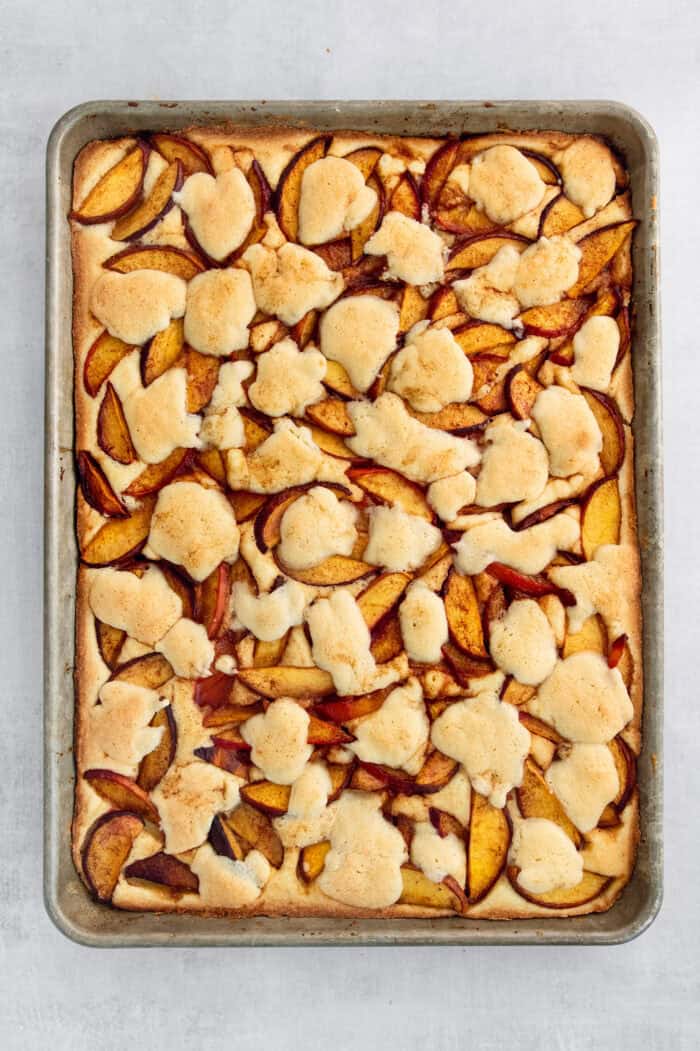 The remaining crust is added on top of the peaches.
