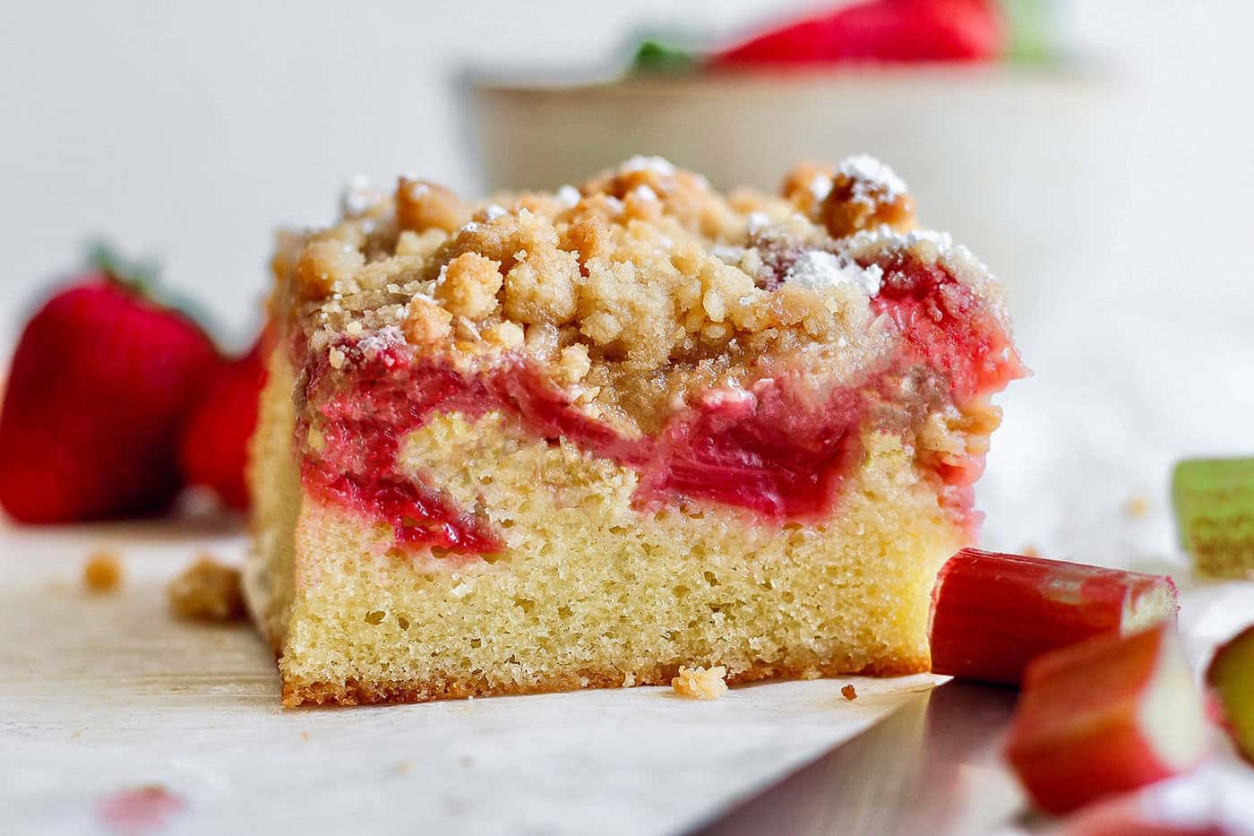 side view of a strawberry rhubarb bar with crumb topping
