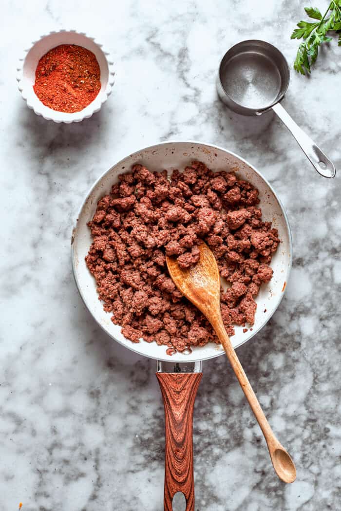 Beef is browned in a skillet.