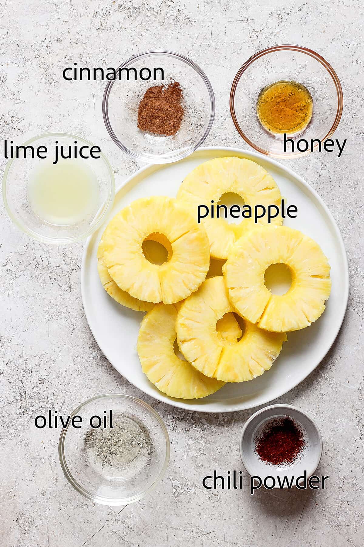 Ingredients for grilled pineapple are labeled: pineapple, honey, oil, lime juice, chili powder, cinnamon.