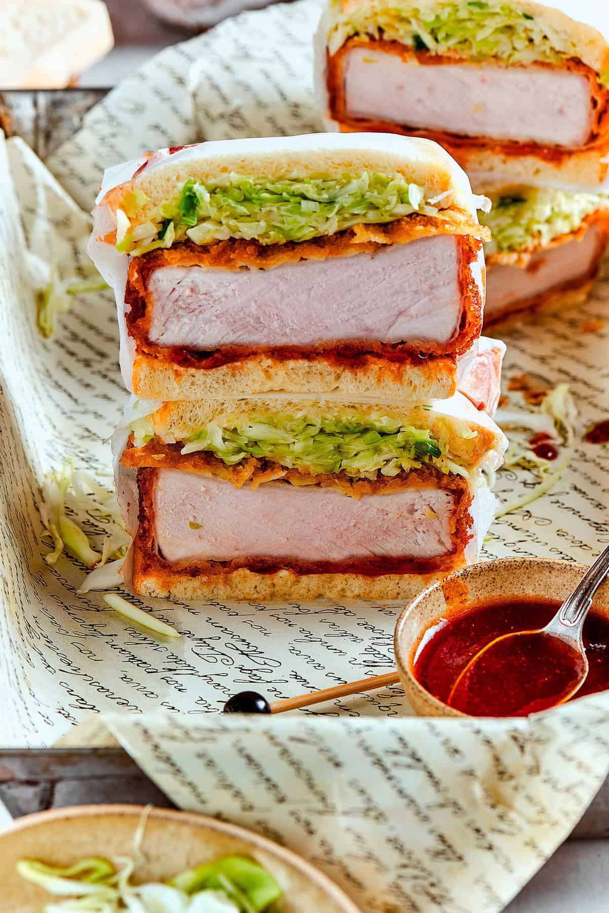 a stack of sliced pork katsu sandwiches