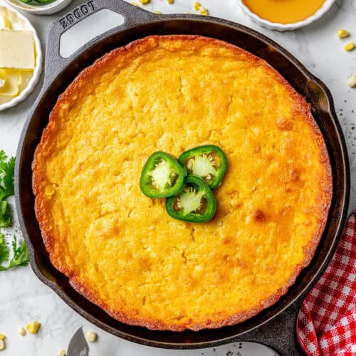 overhead photo of Jiffy corn casserole in a cast iron pan
