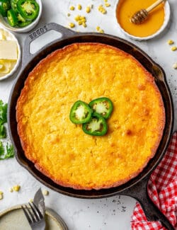 overhead photo of Jiffy corn casserole in a cast iron pan