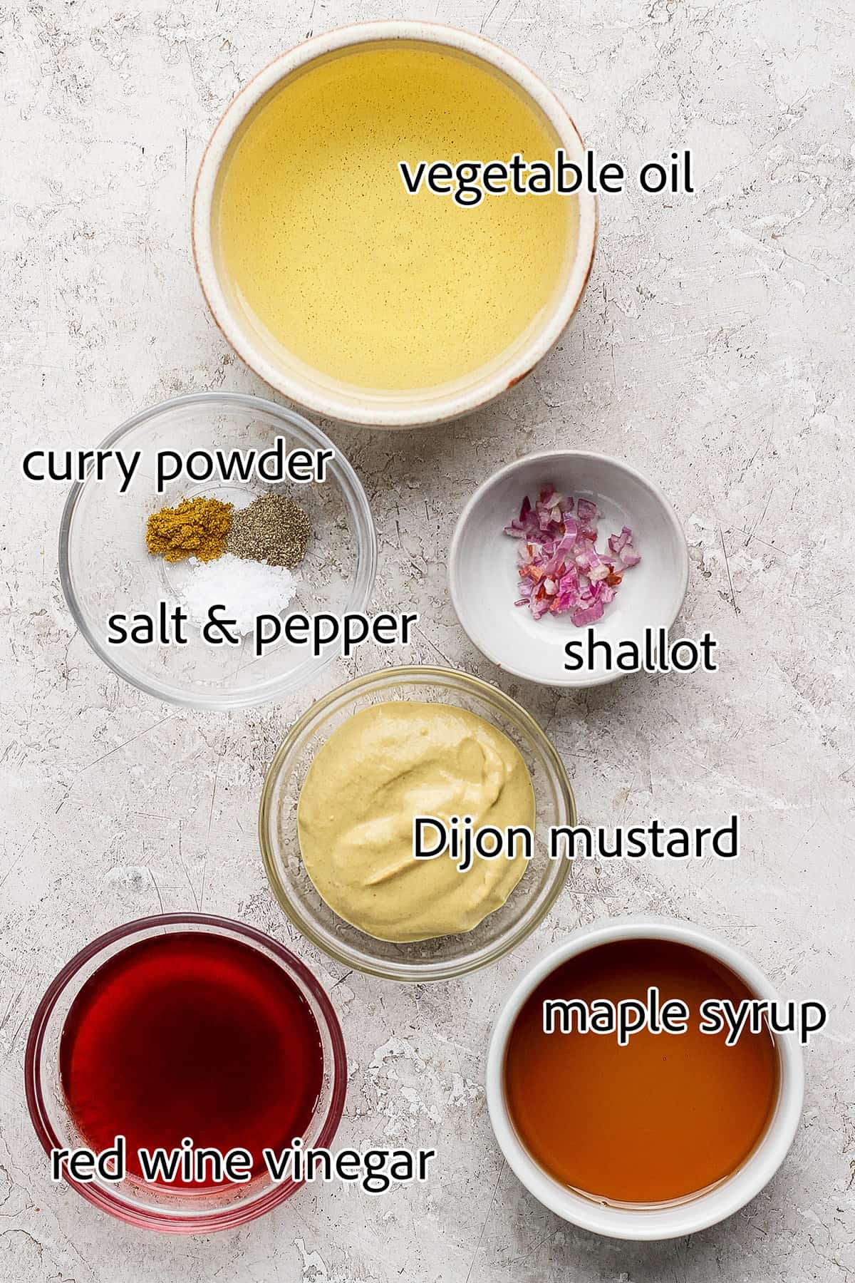 Labeled ingredients for making maple Dijon dressing. 