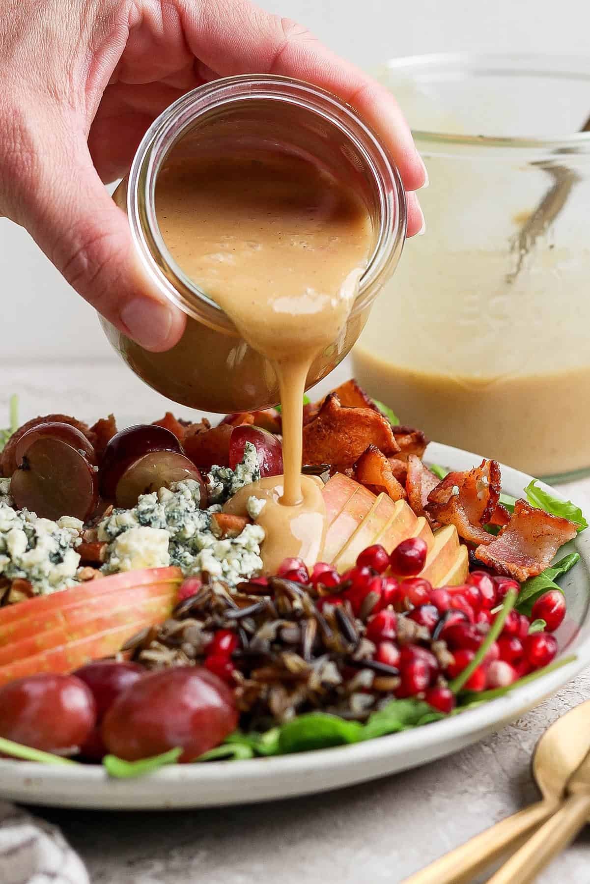 Pouring the dressing over holiday wild rice salad. 