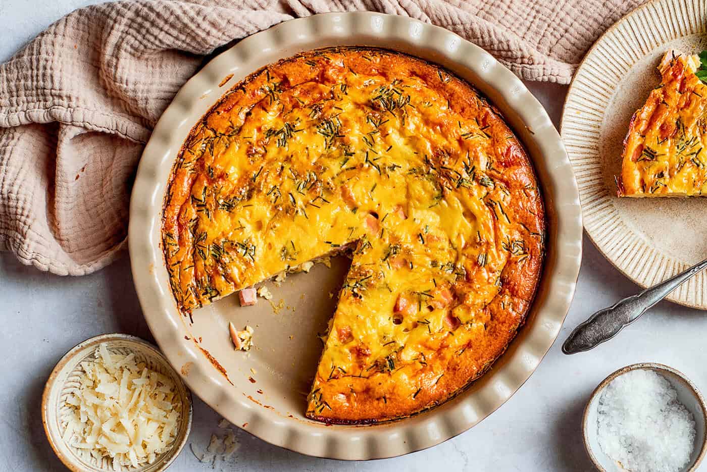 overhead photo of a pie plate of baked crustless quiche