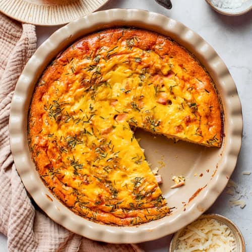 overhead photo of a pie plate of baked crustless quiche