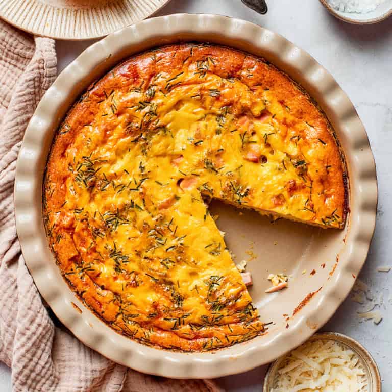 overhead photo of a pie plate of baked crustless quiche