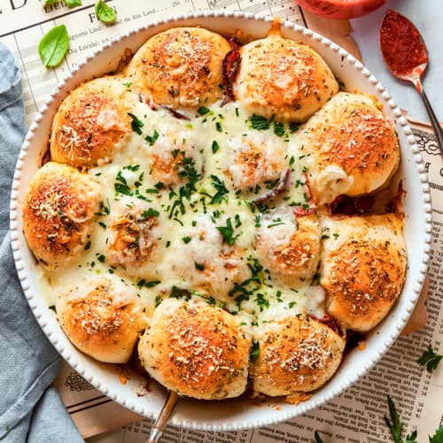 pizza bites in a white baking dish