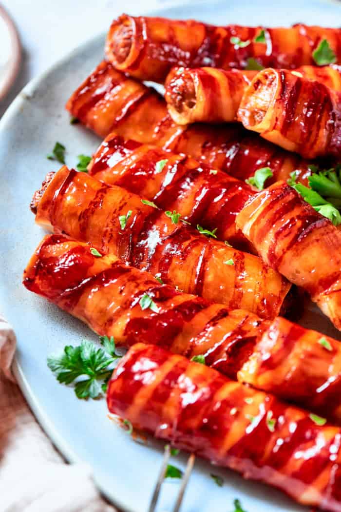 Bacon-wrapped shotgun shells on platter