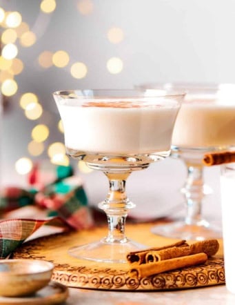 two glasses of vanilla almond steamer and twinkly lights