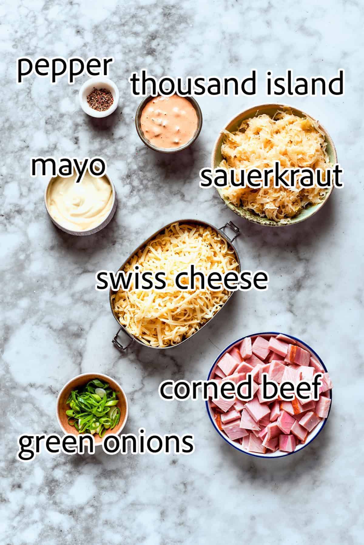 This easy hot Reuben Dip recipe is gorgeously creamy and tangy, and loaded with savory corned beef. All the flavors of the sandwich! ingredients for reuben dip
