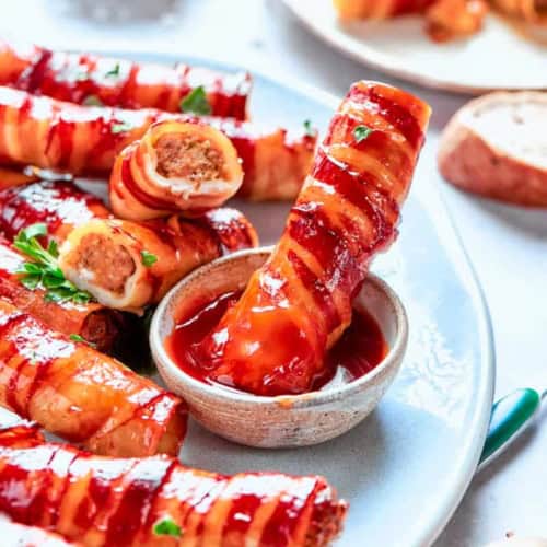 shotgun shells appetizer on a plate with BBQ sauce