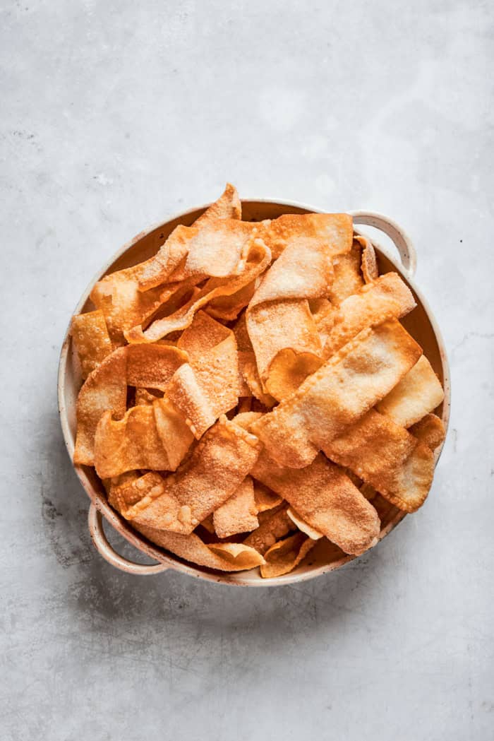 Overhead view of wonton chips in bowl