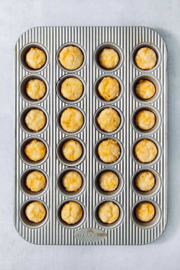Overhead view of pandebono in mini muffin pan