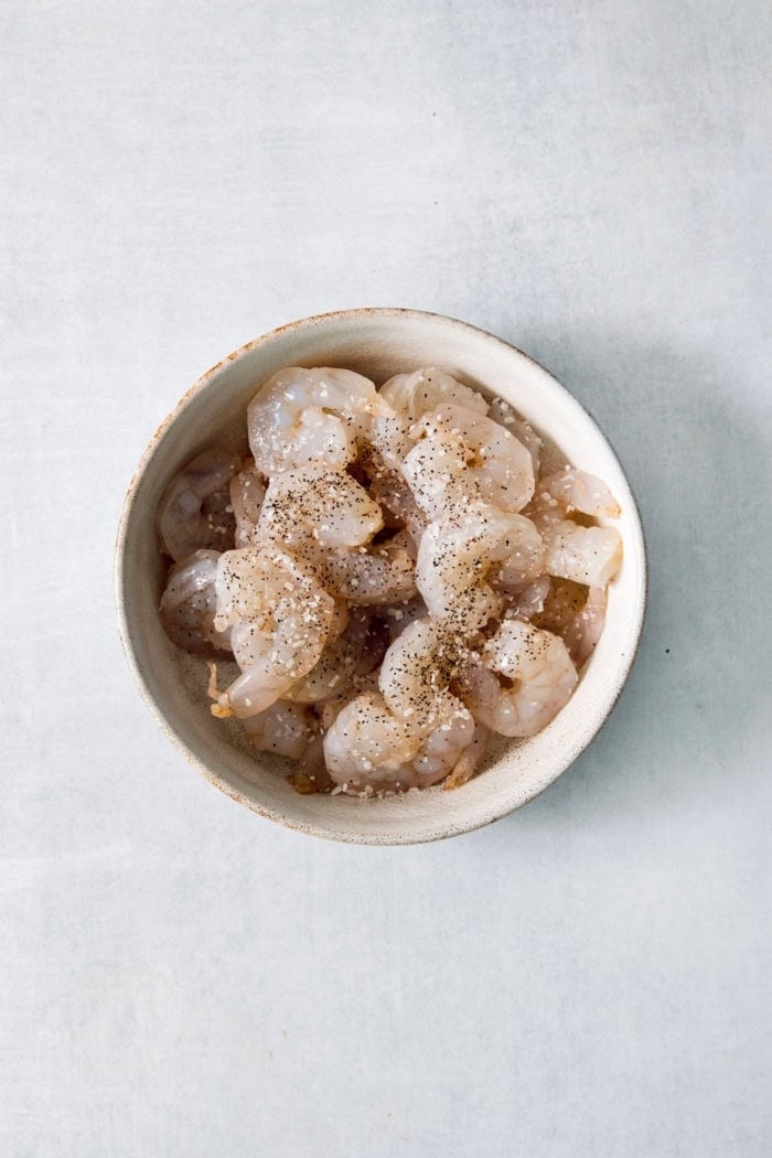 Shrimp in bowl with salt and pepper