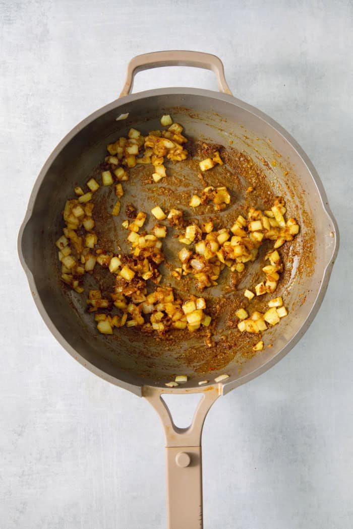 Aromatics cooking in saucepan